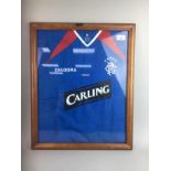 A FRAMED SIGNED RANGERS FOOTBALL TOP