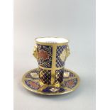 A CAVERSWALL 'ROMANY' PATTERN BEAKER AND STAND ANDTWO PLATES