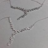 TWO SILVER NECKLETS