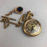 A GILT METAL POCKET WATCH WITH ALBERT AND FOB