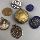 A GROUP OF FOBS, BADGES AND A COIN HOLDER