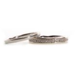 A DIAMOND HALF ETERNITY RING AND A WEDDING BAND