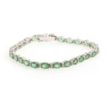 AN EMERALD AND DIAMOND BRACELET