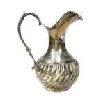 A CONTINENTAL SILVER WATER JUG