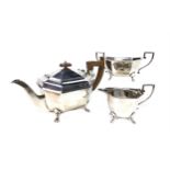 A SILVER THREE PIECE TEA SERVICE