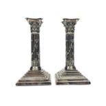 A PAIR OF VICTORIAN SILVER CORINTHIAN PILLAR CANDLESTICKS