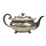 A GEORGE III SILVER TEA POT