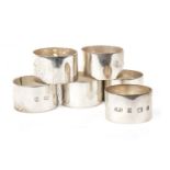 A SET OF SIX SILVER NAPKIN RINGS