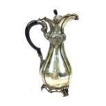 AN EDWARDIAN SILVER WINE JUG