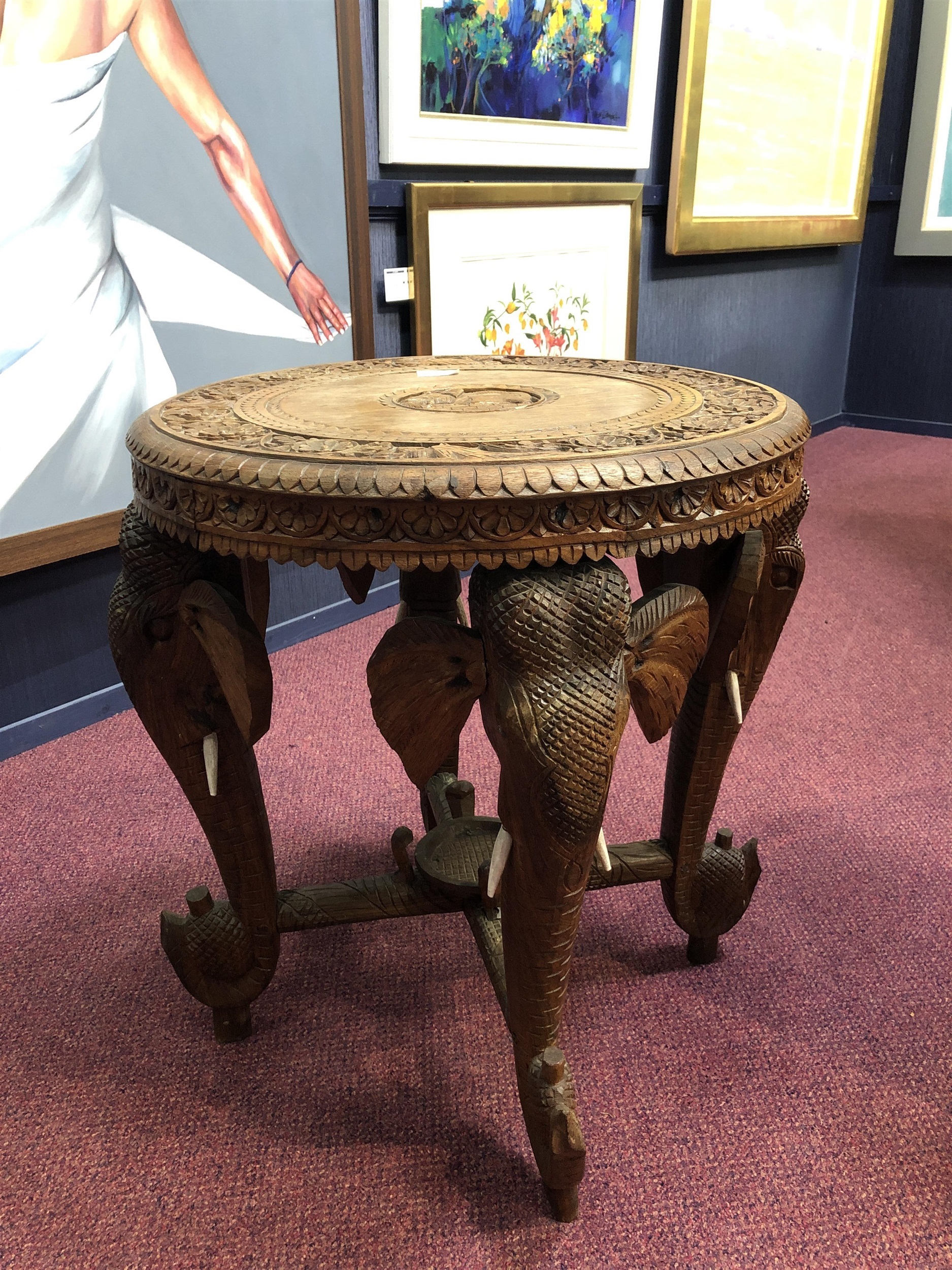 A MID-20TH CENTURY INDIAN CARVED ELEPHANT OCCASIONAL TABLE