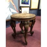 A MID-20TH CENTURY INDIAN CARVED ELEPHANT OCCASIONAL TABLE