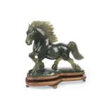 A CHINESE FIGURE OF A GALLOPING HORSE