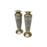 A PAIR OF EASTERN SILVER CANDLESTICKS