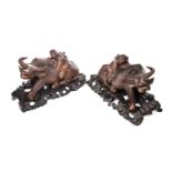 A PAIR OF CARVED WOOD BUFFALO