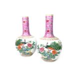 A PAIR OF EARLY 20TH CENTURY CHINESE FAMILLE ROSE VASES