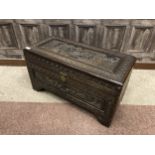 A CHINESE CARVED WOOD CHEST