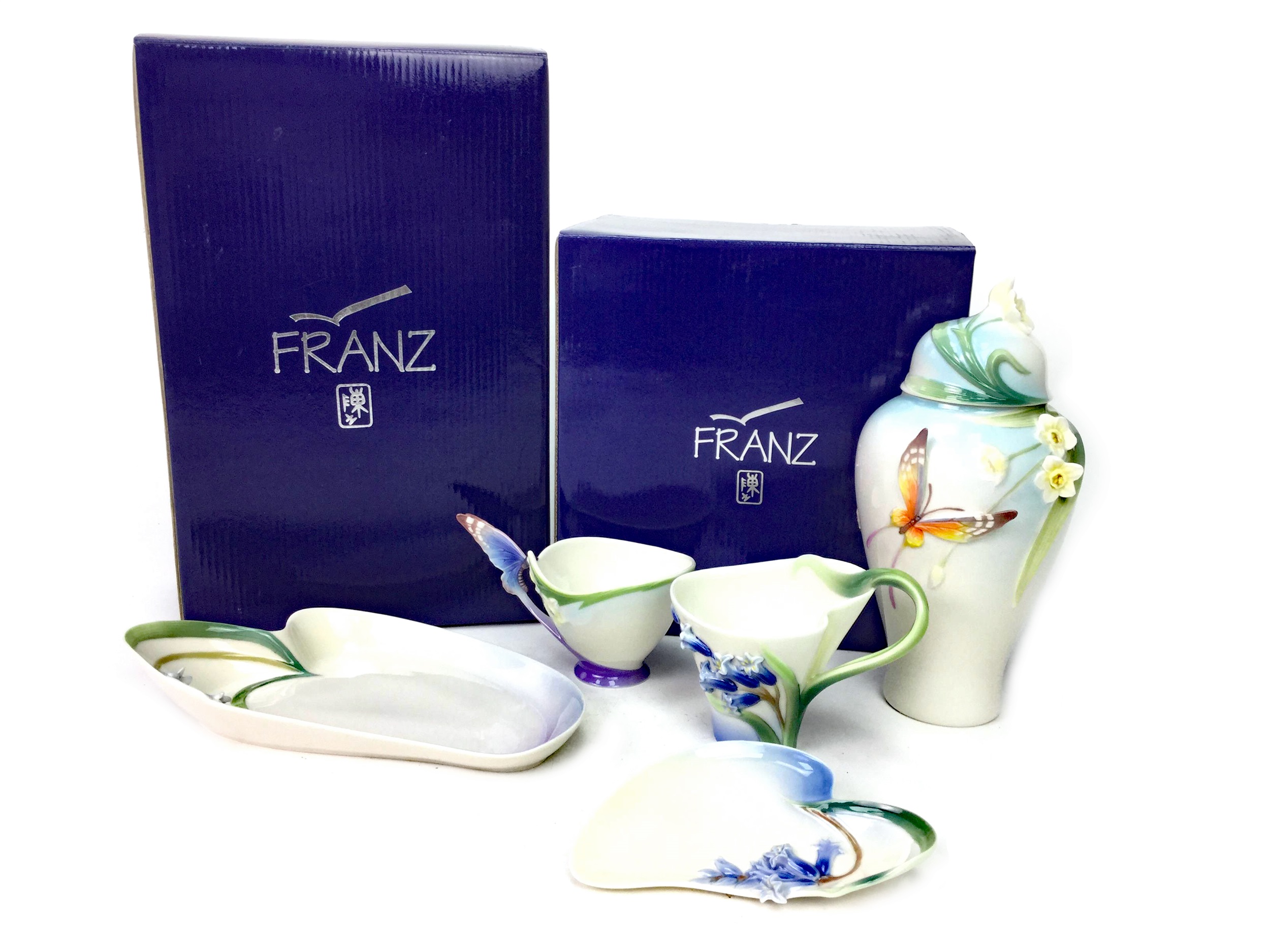 A LOT OF TWO FRANZ CUP AND SAUCERS, TRAY AND GINGER JAR