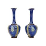 A PAIR OF ROYAL DOULTON STONEWARE VASES