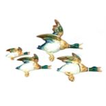 A SET OF FOUR BESWICK FLYING DUCKS