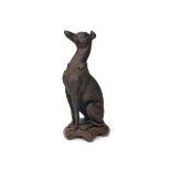 A VICTORIAN CAST METAL FIGURE OF A SEATED WHIPPET