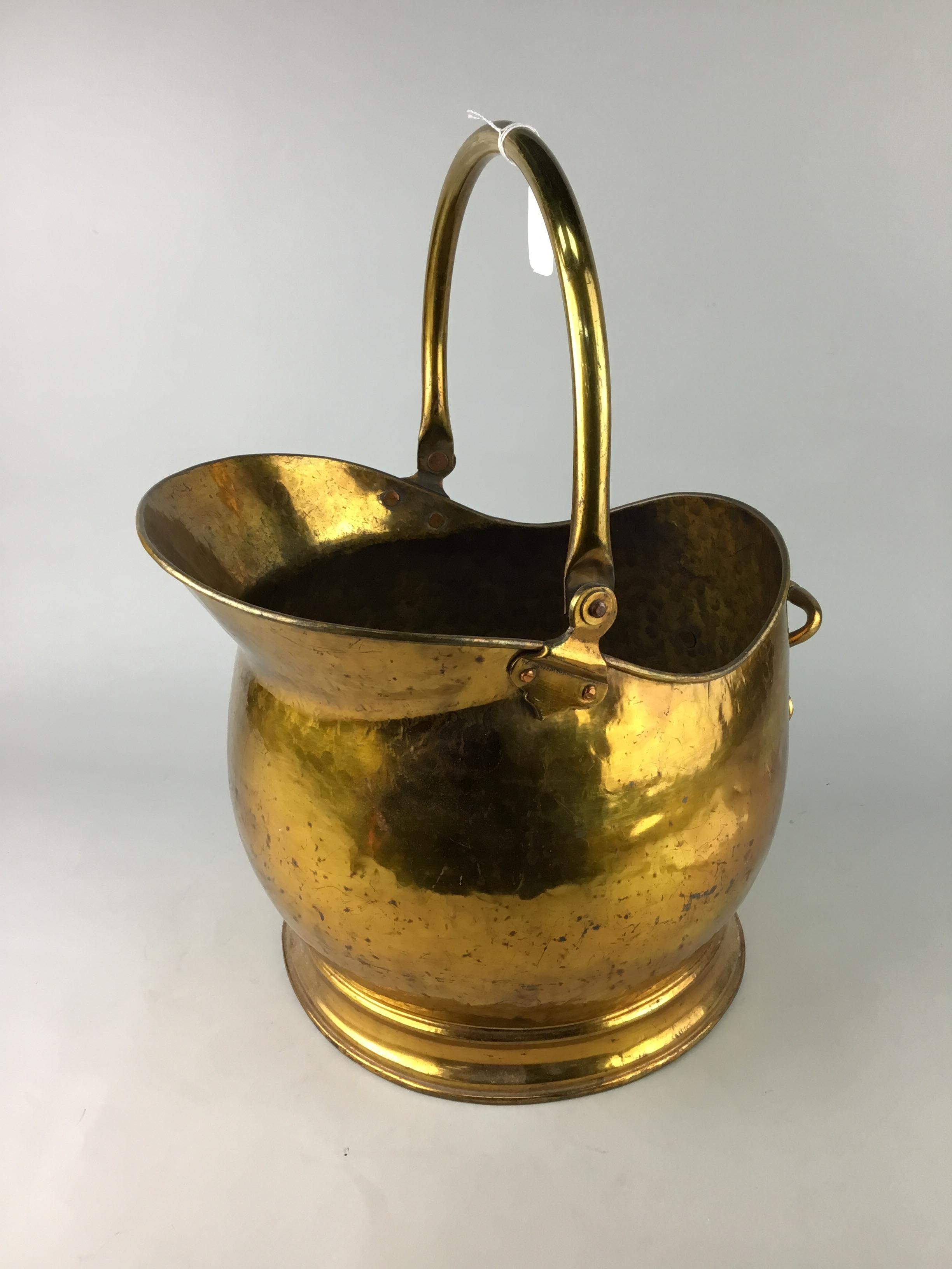 A HAMMERED COAL SCUTTLE