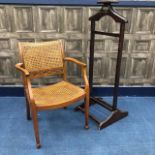 A CANED BACK OPEN ELBOW CHAIR AND A TROUSER STAND