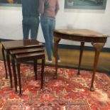 A MAHOGANY NEST OF THREE TABLES AND A WALNUT CORNER TABLE