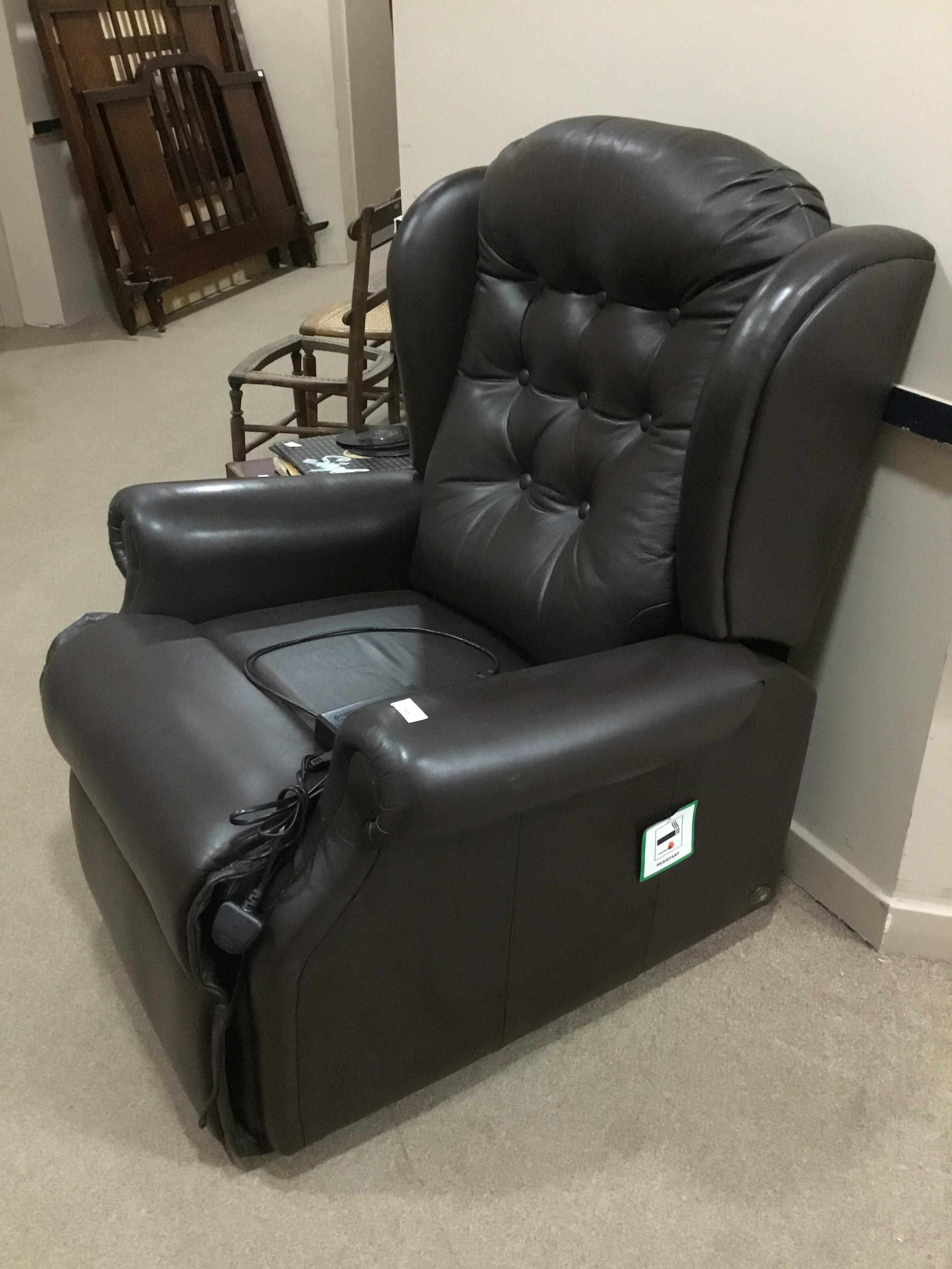 A MODERN ELECTRIC LEATHER ARMCHAIR