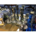 A LOT OF TWO PAIRS OF CANDLESTICKS AND A LADLE