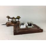 A MAHOGANY INK STAND, POSTAL SCALES AND A VINTAGE TOOL