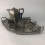 A PEWTER TEA SERVICE AND A PAIR OF CANDLESTICKS