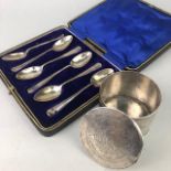 A SET OF SIX SILVER COFFEE SPOONS AND A WHITE METAL LIDDED JAR