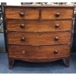 A MAHOGANY BOWFRONT CHEST OF DRAWERS