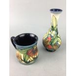 A MOORCROFT VASE, A MOORCROFT MUG AND ANOTHER TWO VASES