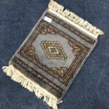 A MINIATURE EASTERN PRAYER MAT