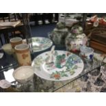 A CHINESE FAMILLE ROSE GINGER JAR AND COVER, TWO TEA BOWLS, A BRUSH POT AND A SPOON