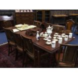 A MAHOGANY DINING TABLE AND EIGHT CHAIRS