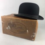 A BLACK TOP HAT ALONG WITH A BOWLER HAT