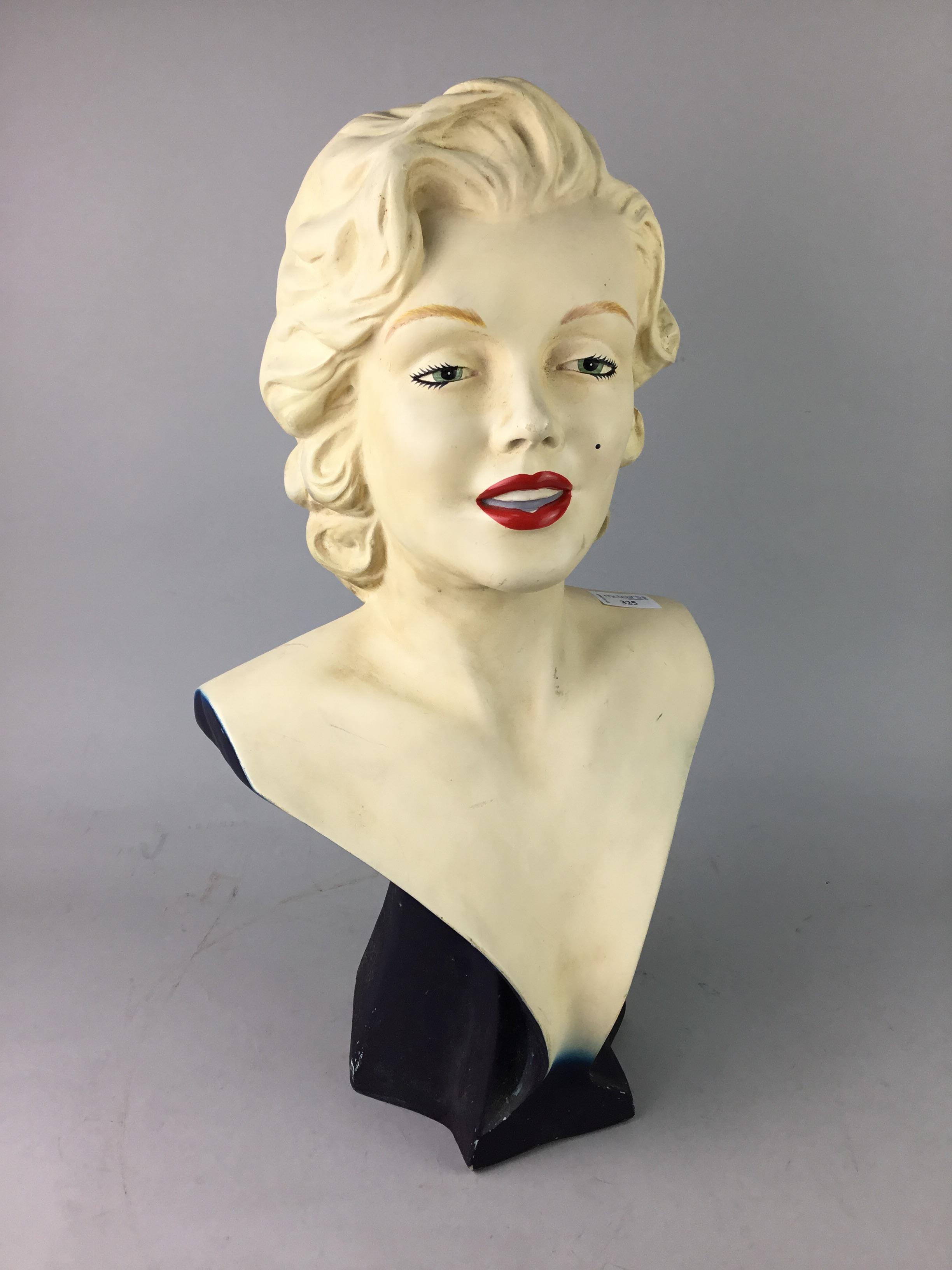 A PAINTED PLASTER BUST OF MARILYN MUNRO