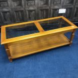 A GLASS TOPPED COFFEE TABLE