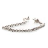 A DIAMOND TENNIS BRACELET