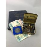 AN ALBUM OF EARLY 20TH CENTURY STAMPS ALONG WITH COINS