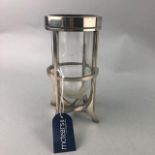 A SILVER PLATED AND GLASS CANDLE STAND