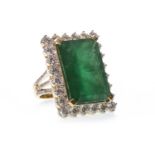 A VERY IMPRESSIVE EMERALD AND DIAMOND RING