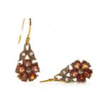 A PAIR OF GARNET AND DIAMOND EARRINGS