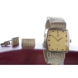 A GENTLEMAN'S GOLD OMEGA DE VILLE WRIST WATCH