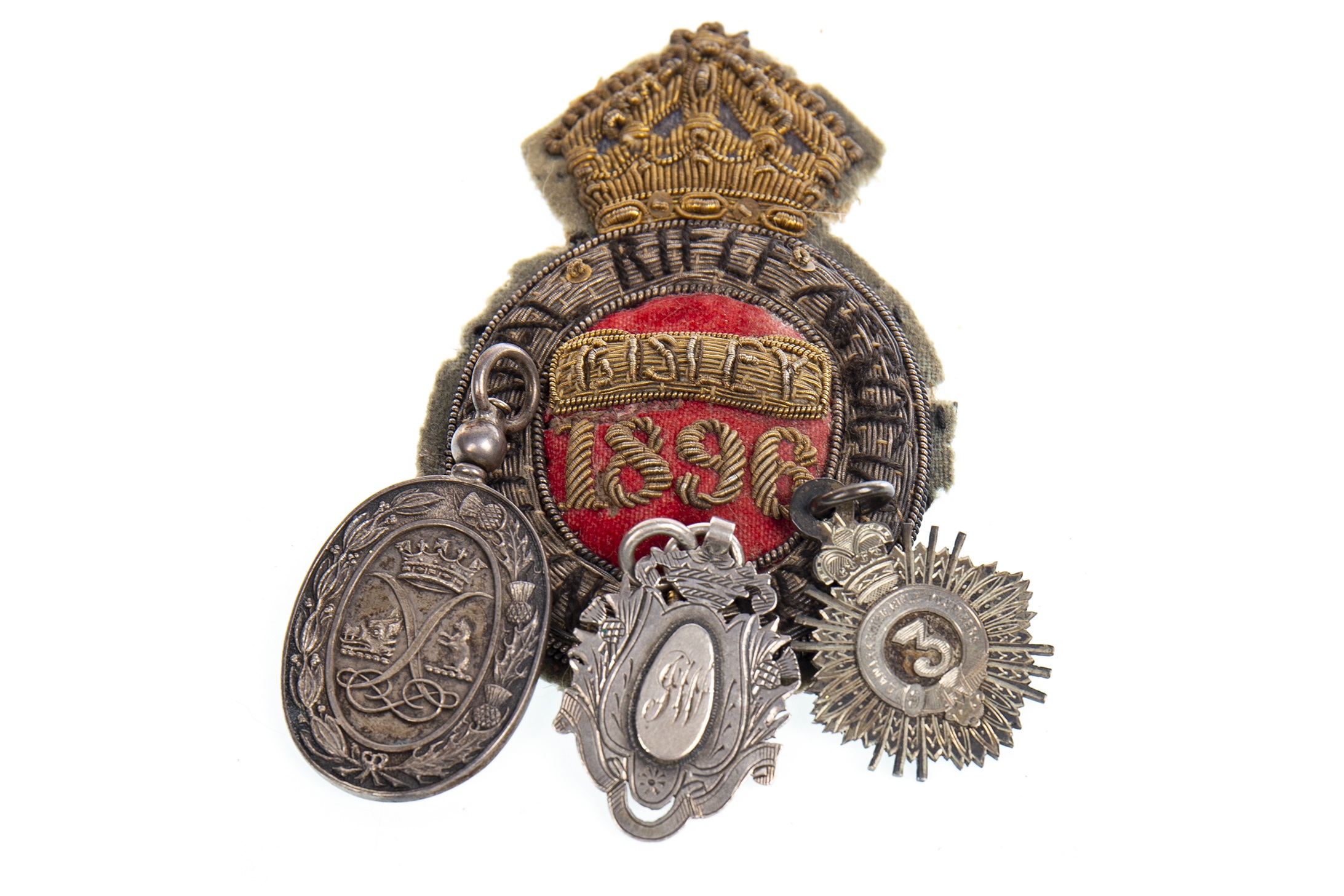 A VICTORIAN LANARKSHIRE RIFLE VOLUNTEERS MEDAL AND RIFLE ASSOCIATION BADGE