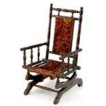 A STAINED BEECH CHILD'S AMERICAN ROCKING CHAIR, EARLY 20TH C