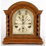 A GERMAN OAK MANTLE CLOCK WITH THREE TRAIN MOVEMENT, THE SILVERED DIAL INSCRIBED A MASON WILLIAMS