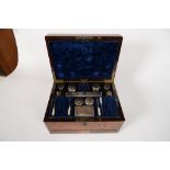 A VICTORIAN BRASS MOUNTED ROSEWOOD DRESSING CASE WITH FITTED INTERIOR AND ACCESSORIES